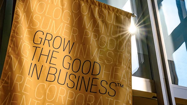 Yellow Mendoza College of Business grow the good in business lobby banner