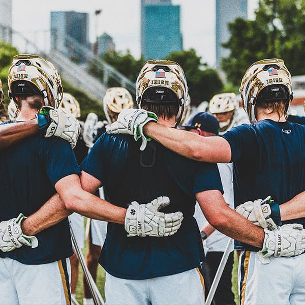 Notre Dame men's LAX team huddled up in a circle