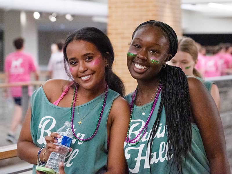 Two Badin Hall Students smiling and taking part in campus activities